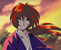 Kenshin looking particularly grim and focused as his flame-red hair blows to the side.